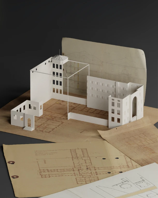 Digital erstelltes Architekturmodell eines historischen Gebäudes, arrangiert auf alten Bauplänen; zeigt die Rekonstruktion eines Gefängnisses anhand historischer Dokumente.